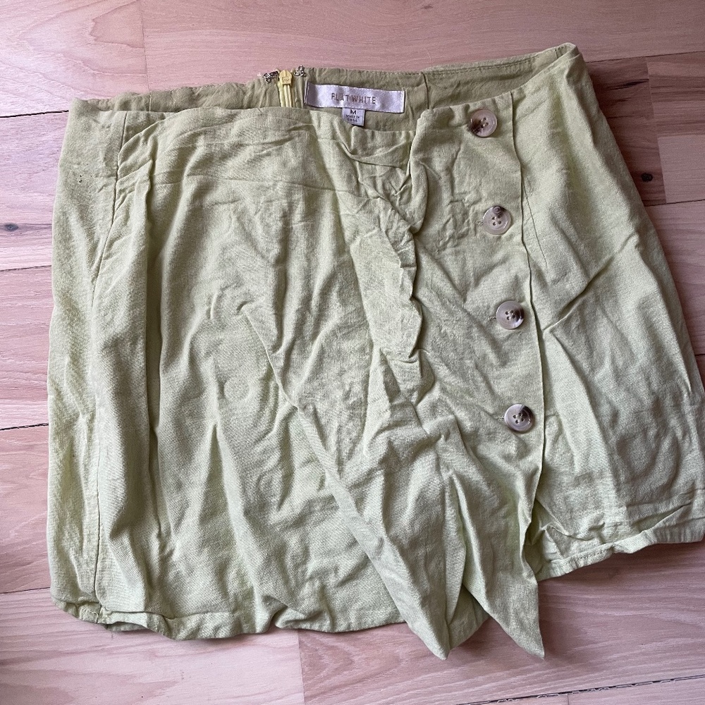 Anthropologie flat white  brand sea foam green skort with button